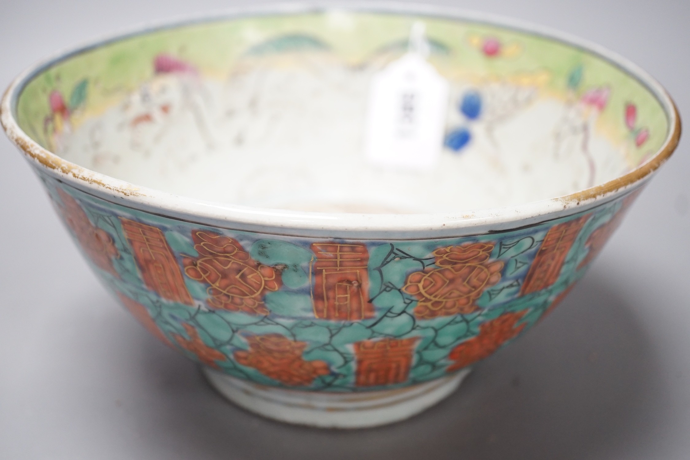 An 18th century clobbered Chinese or Japanese porcelain bowl, 24.5cm diameter